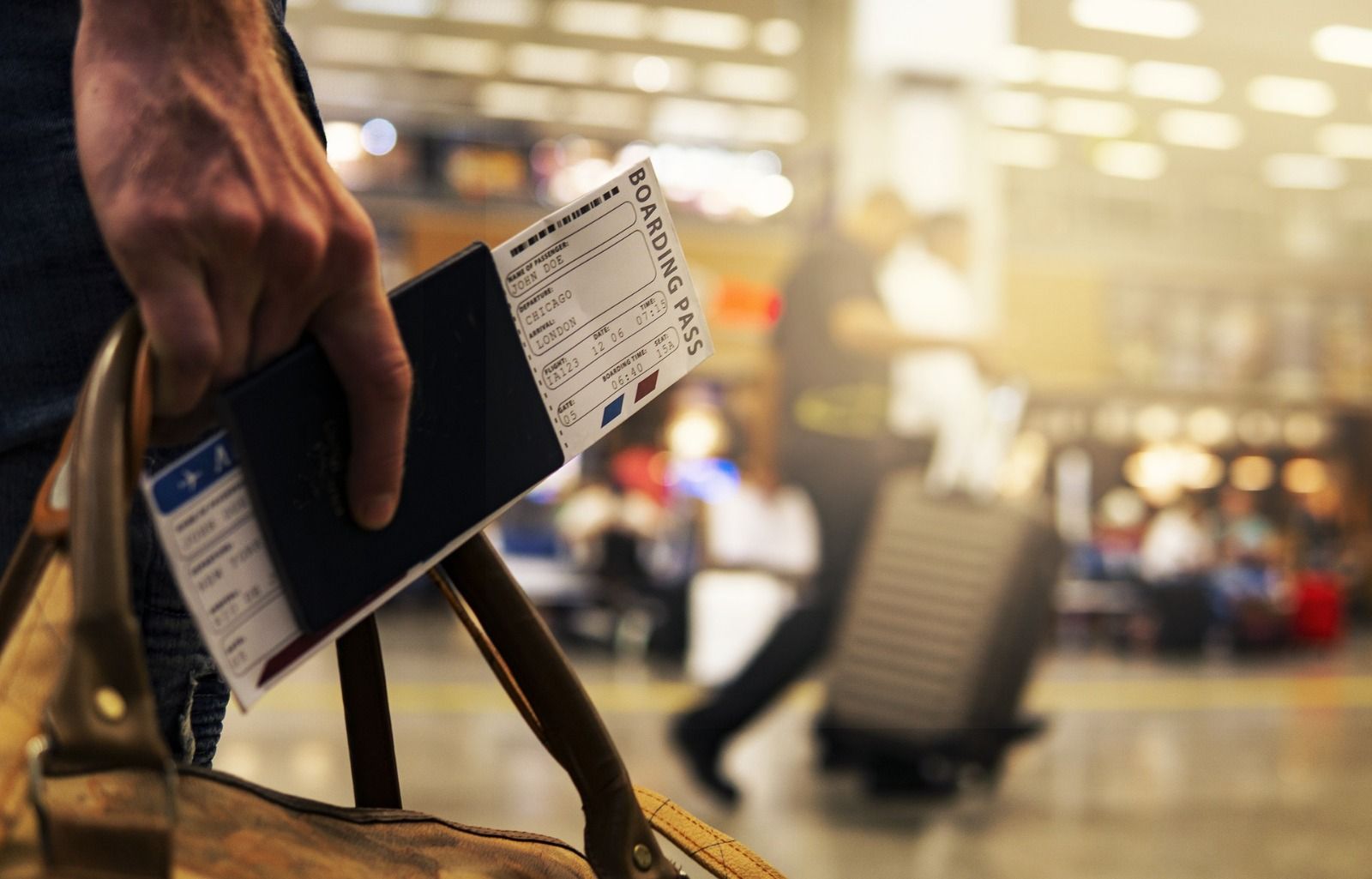 Passanger holding a bag and passport