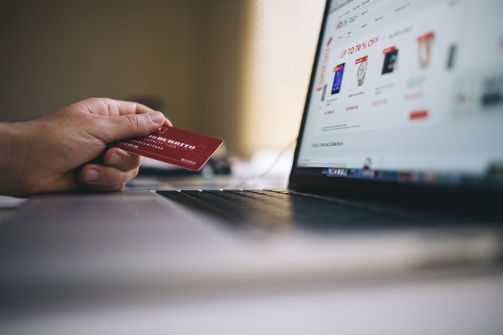 Person using a credit card to make an online purchase